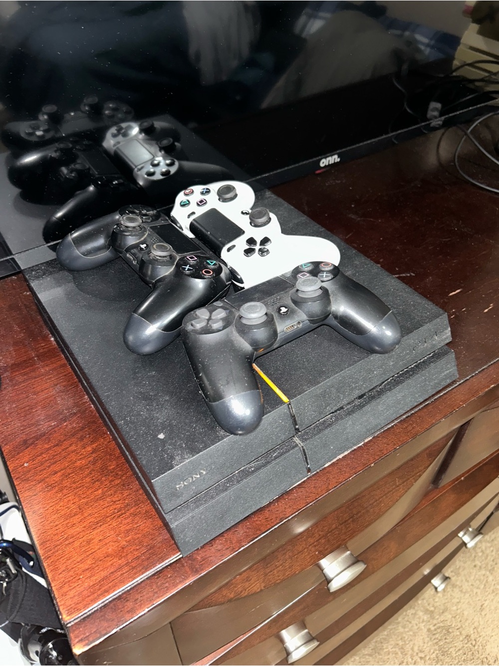 Sony PS4 Console with 2 Black and White DualShock Controllers